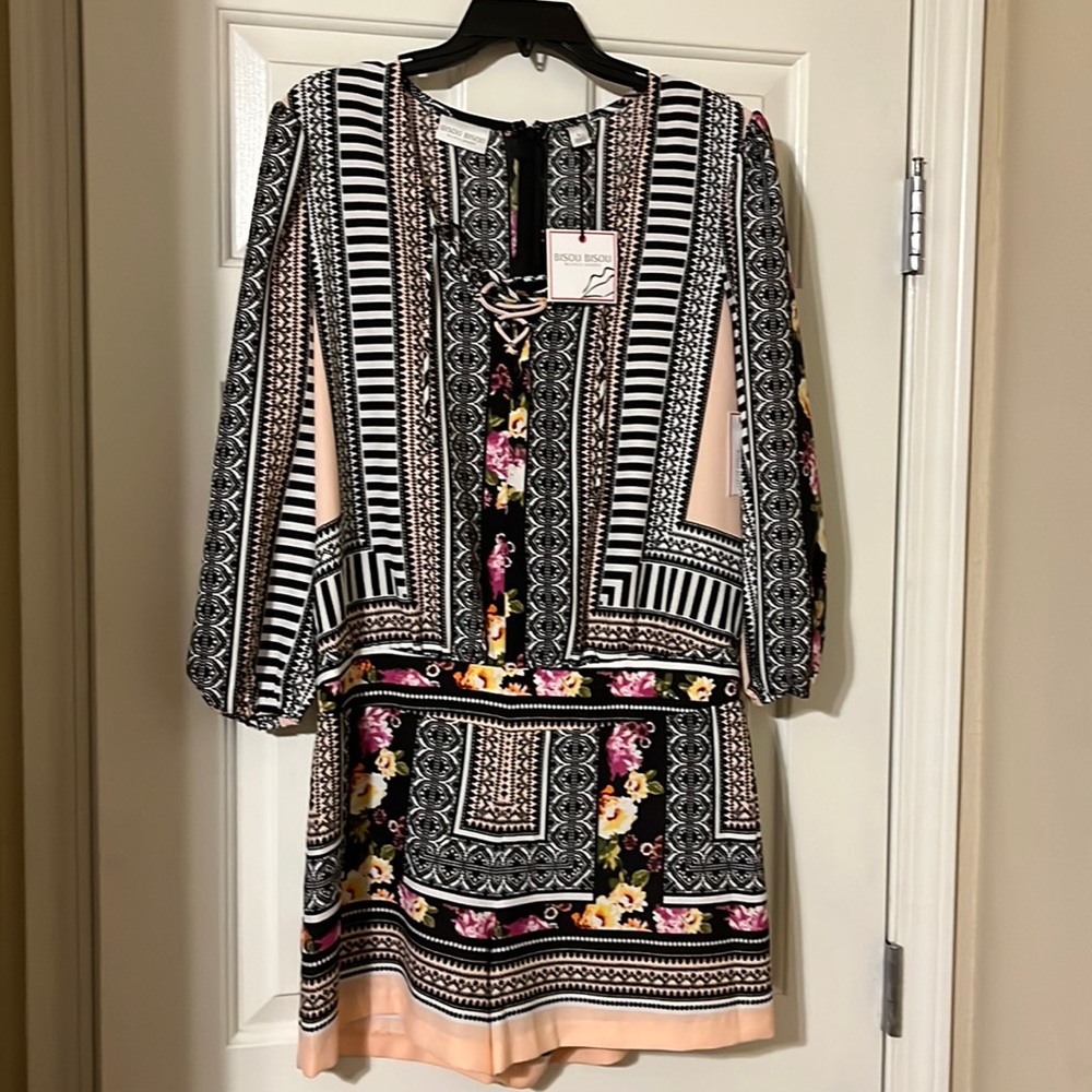 Multi color romper size Large, brand new with tags.
